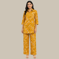 Mustard yellow printed kurta pant set for women with collared 3/4 sleeve top and matching pants